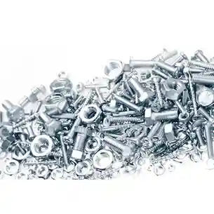 Assorted bolts, nuts, washers, and screws in shiny silver metal, piled together in different sizes.<br />
